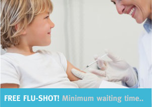 Doctor giving to a child an injection in examination room